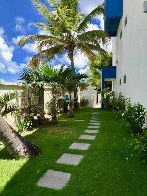  Pathway to the beach, with an outside shower under the trees
 